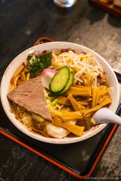 Cold ramen with ice cubes, topped with vegetables and chashu pork