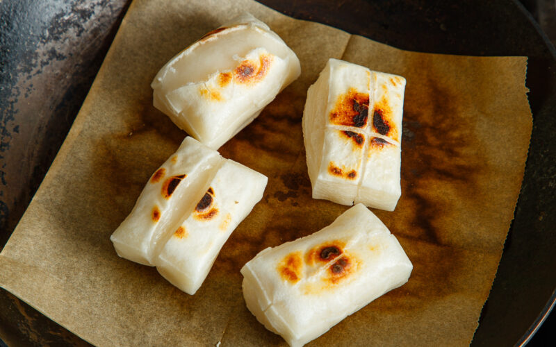 Toasting kiri mochi (Japanese rice cakes) in a frying pan.